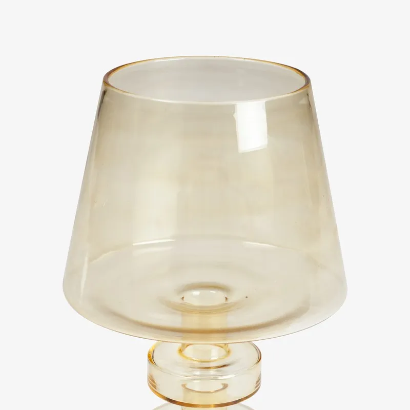 Close-up of the tapered amber glass top of the candle holder