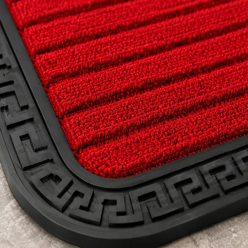Close-up of the red ribbed mat surface with black rubber border