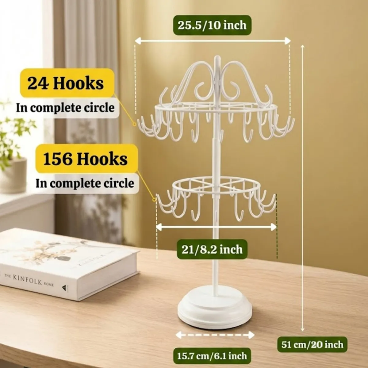 White jewellery stand shown with a round base and curved hooks on a tabletop.