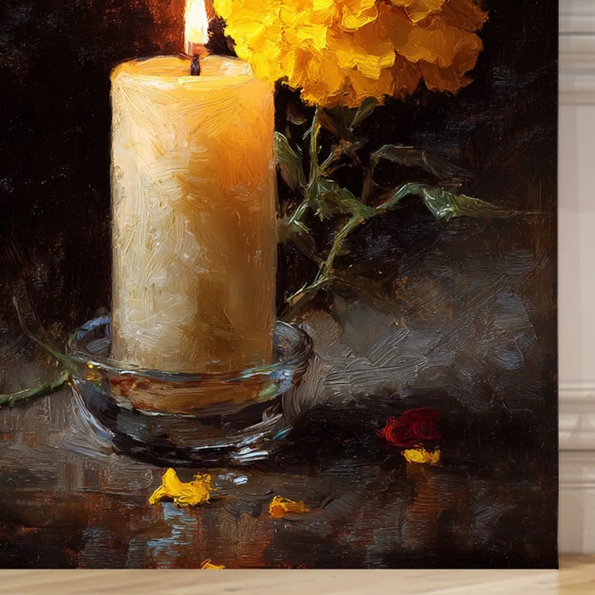 Close-up of candle and marigold artwork on a dark, textured canvas surface