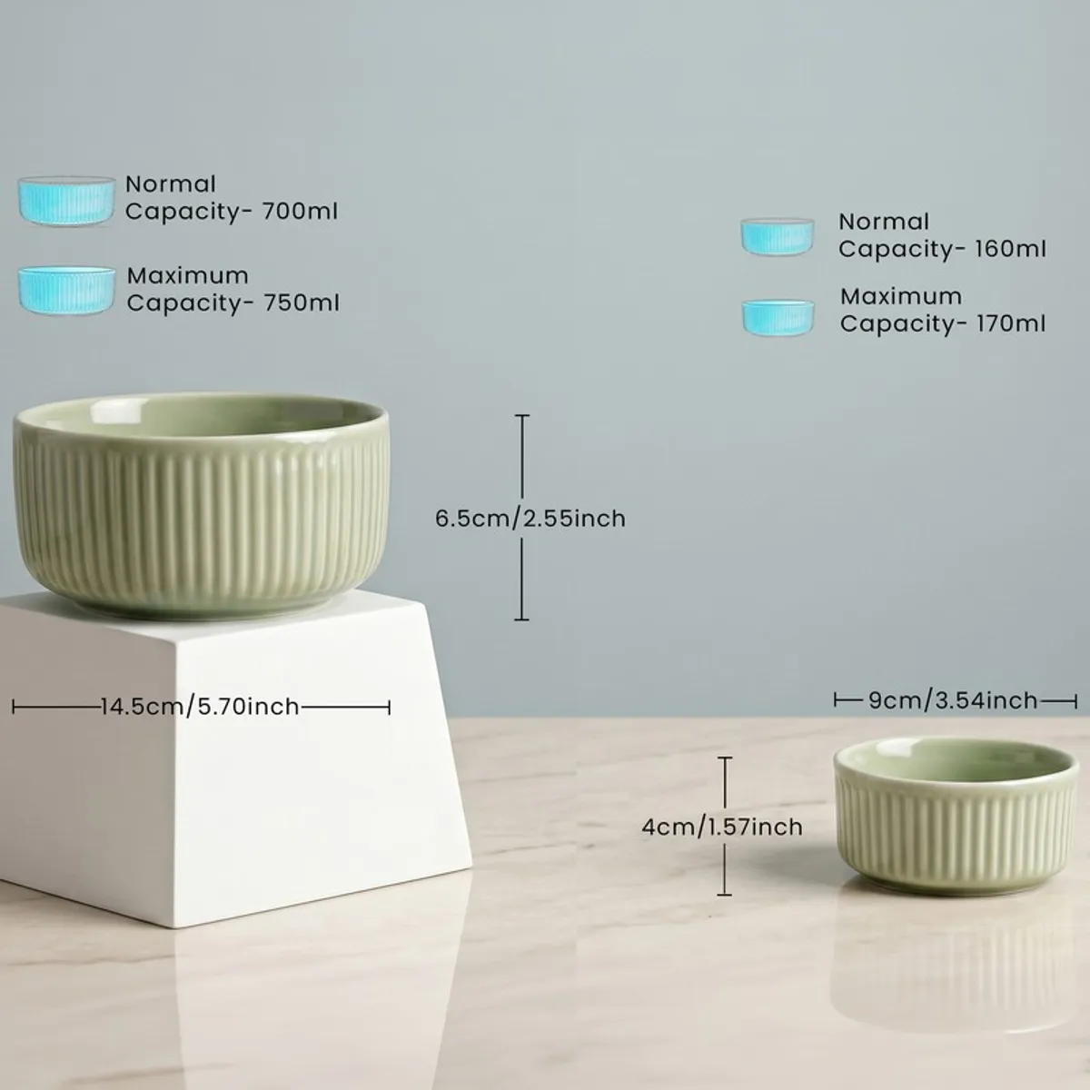 Two sage green ribbed bowls from the dinner set in different sizes