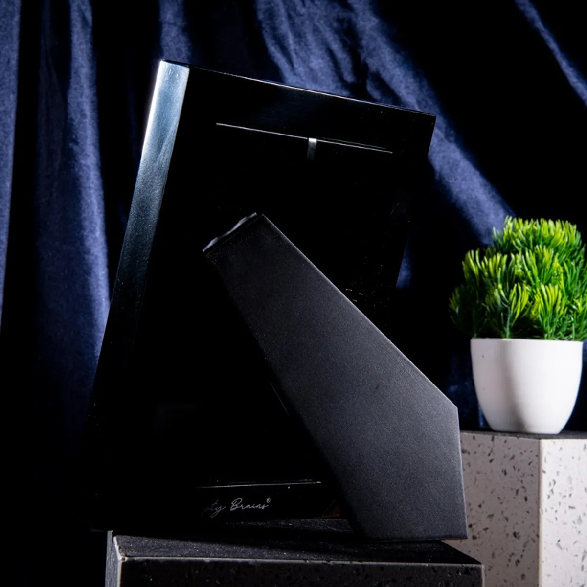 Back view showing the black tabletop stand of the rectangular photo frame