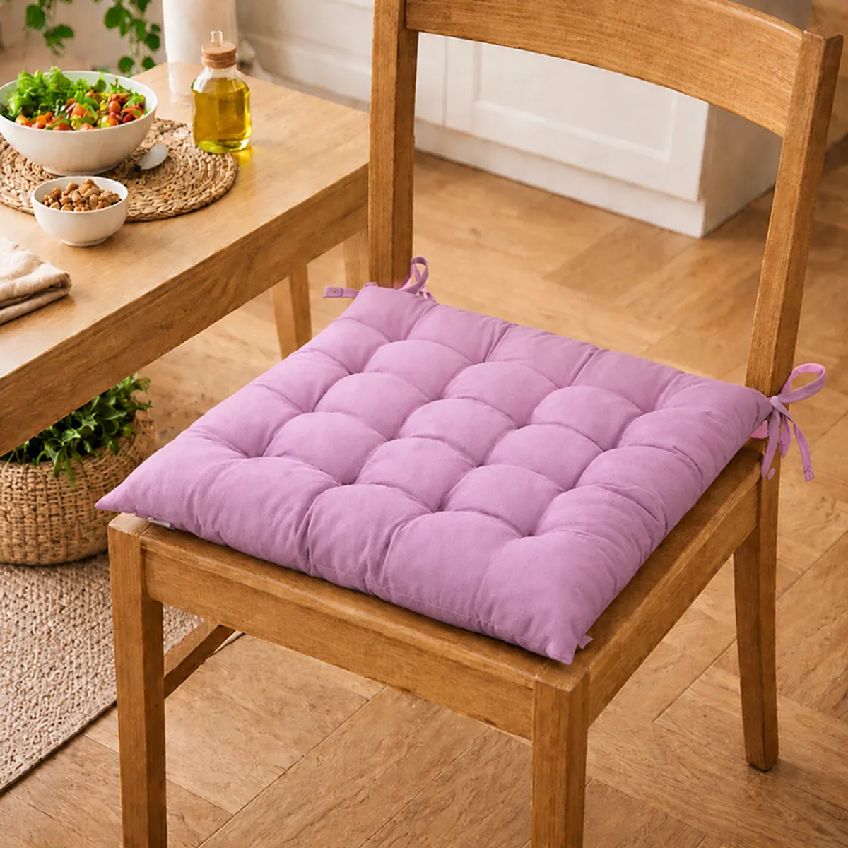 Single lilac purple tufted chair pad on a wooden chair