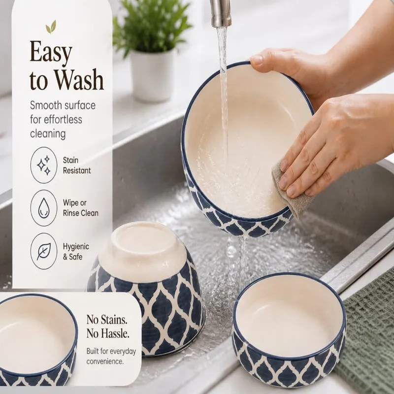 Blue and white ceramic bowls being washed under running water.