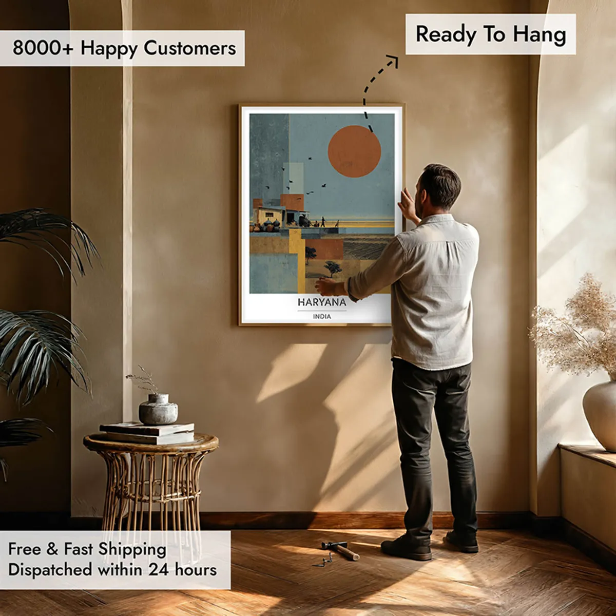 Large framed Haryana wall art being placed on a wall