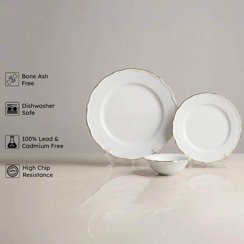 White and gold-rim plates with matching bowl displayed on stands