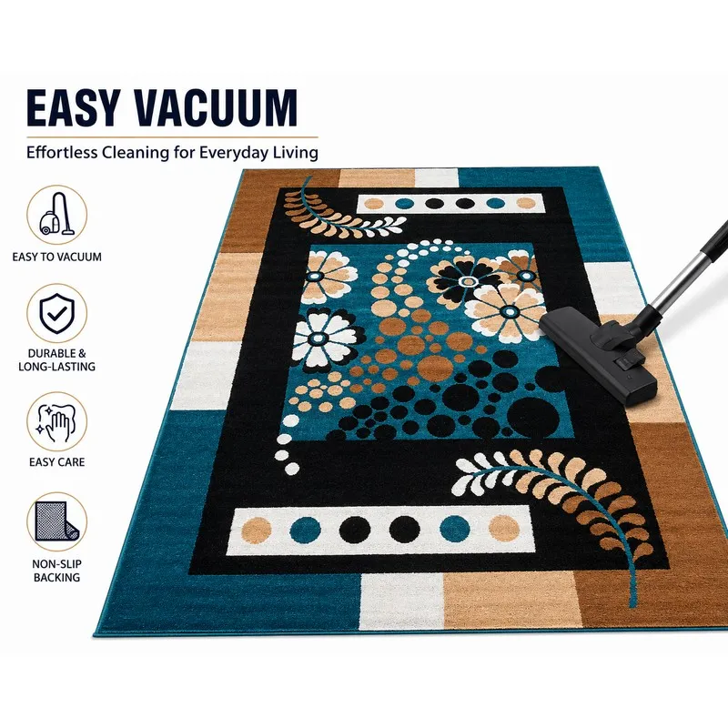 Blue and beige patterned carpet shown with a vacuum on the surface