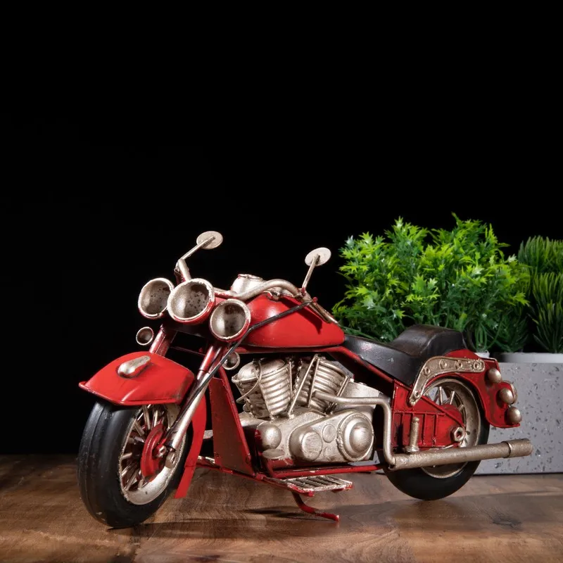 Side view of red vintage motorcycle showpiece with silver engine details