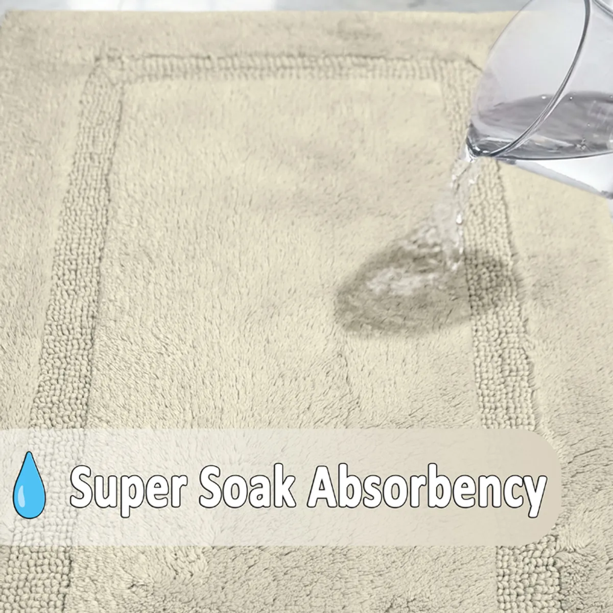 Close-up view of water being absorbed into the textured grey bath mat.