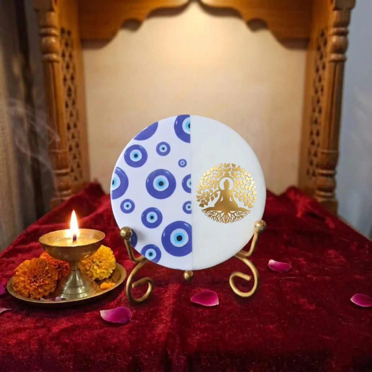 Round blue and white marble showpiece on a gold stand in a festive styled setting.
