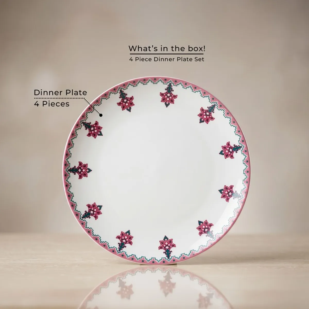 Single pink and white floral dinner plate shown from the front
