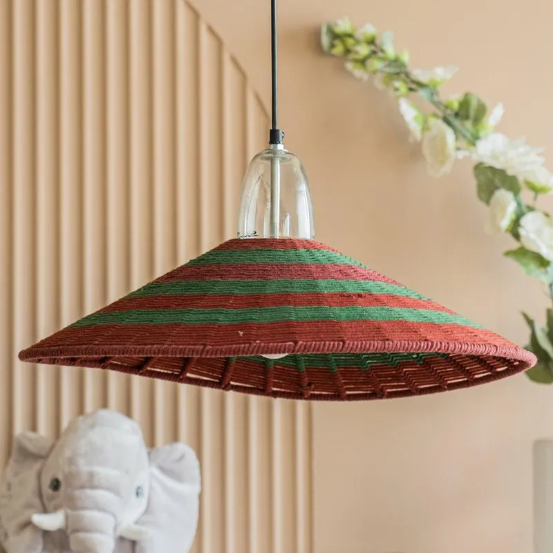 Close view of red and green striped ceiling lamp with transparent top fitting