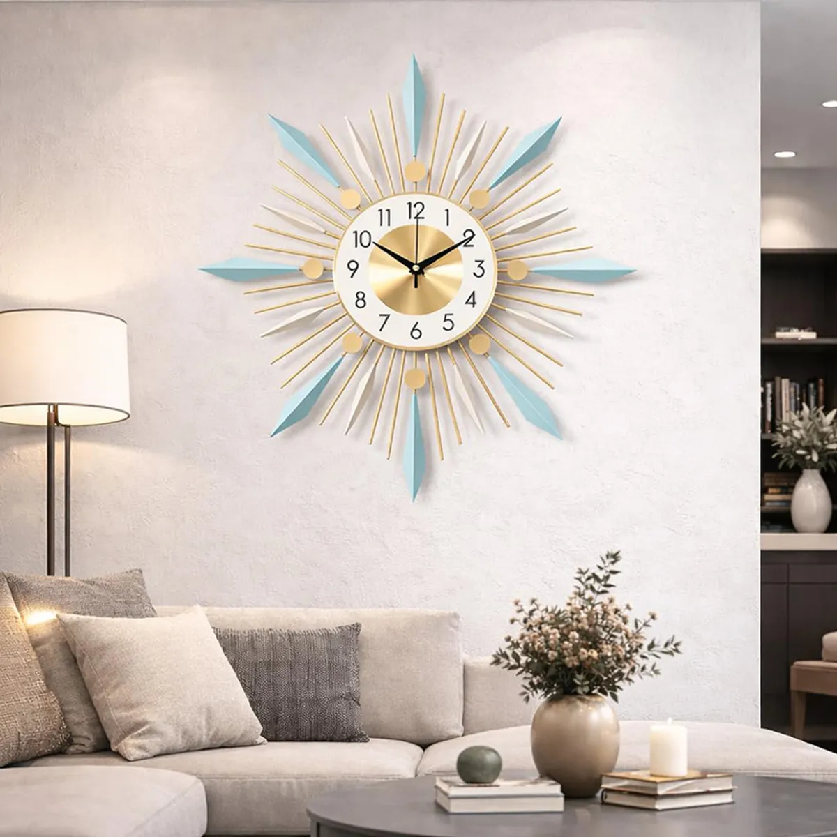 Round gold, white and blue wall clock displayed above a sofa