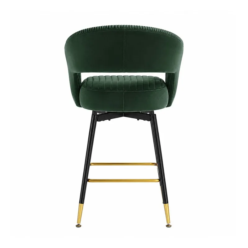 Rear view of a green velvet bar stool with black legs and gold footrest.