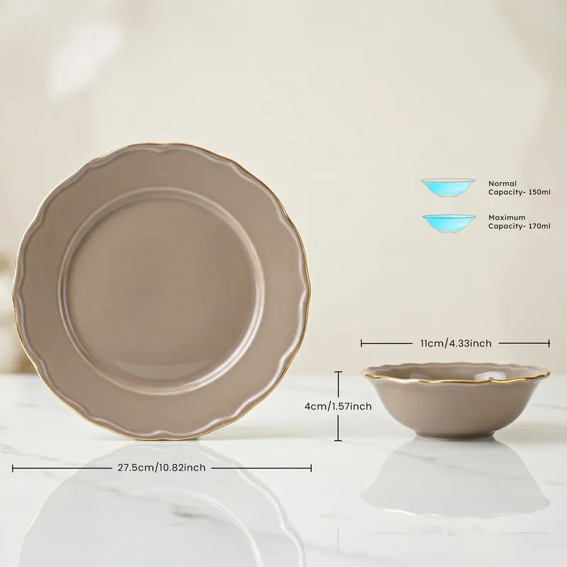 Close view of grey plate and small bowl with gold rim