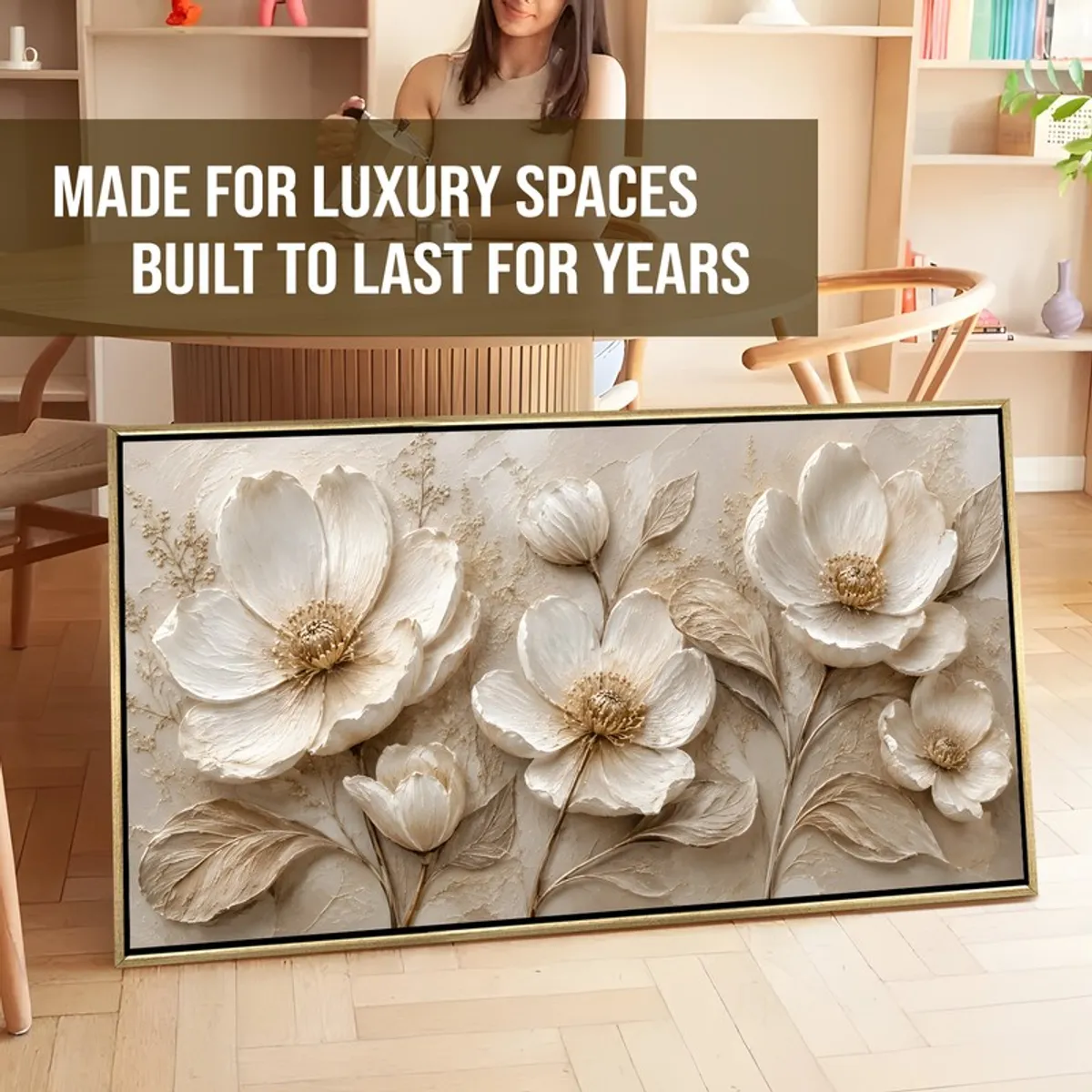 Large ivory floral framed canvas painting leaning in a styled room