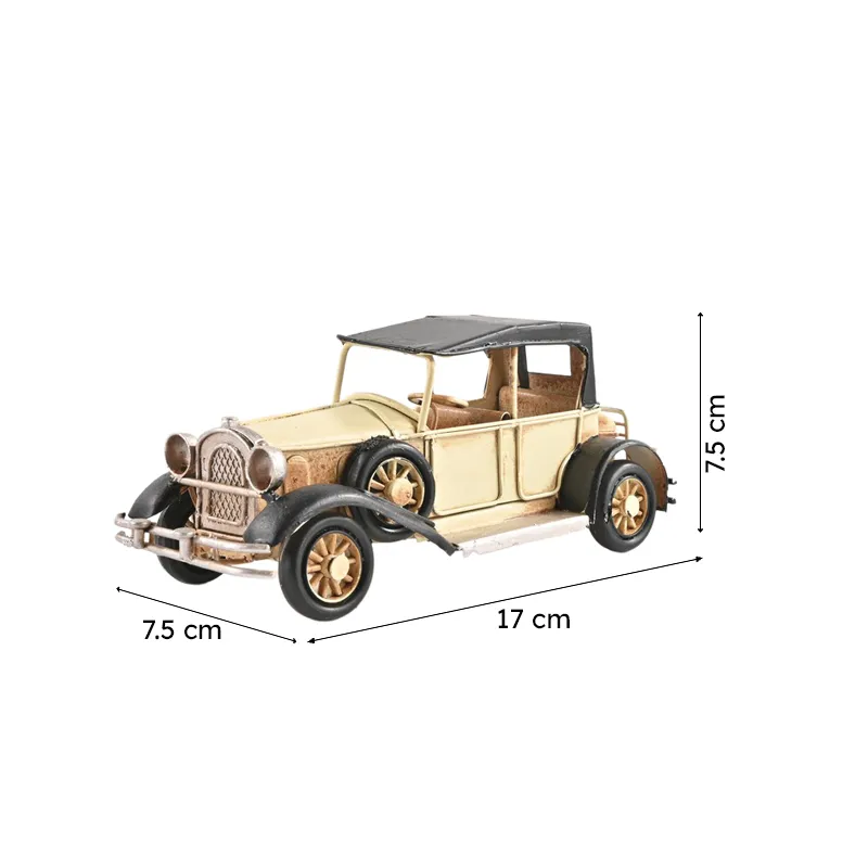 Beige vintage model car showpiece on a white background