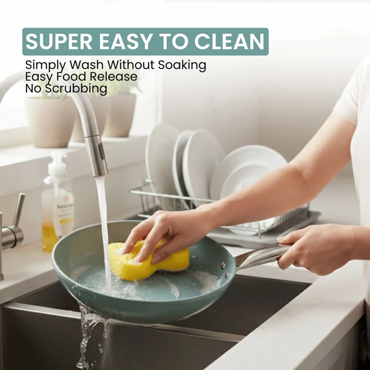 Teal frying pan being washed under running water at a kitchen sink