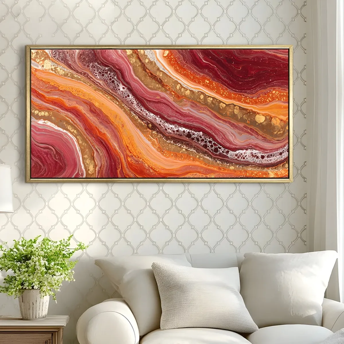 Framed abstract painting in warm tones displayed above a white armchair