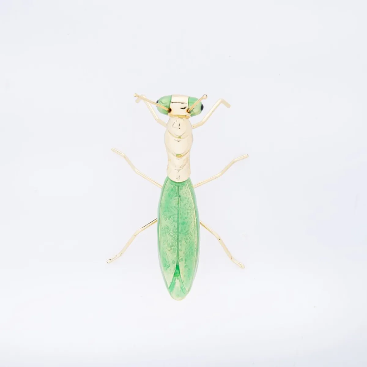 Top view of green and gold praying mantis figurine