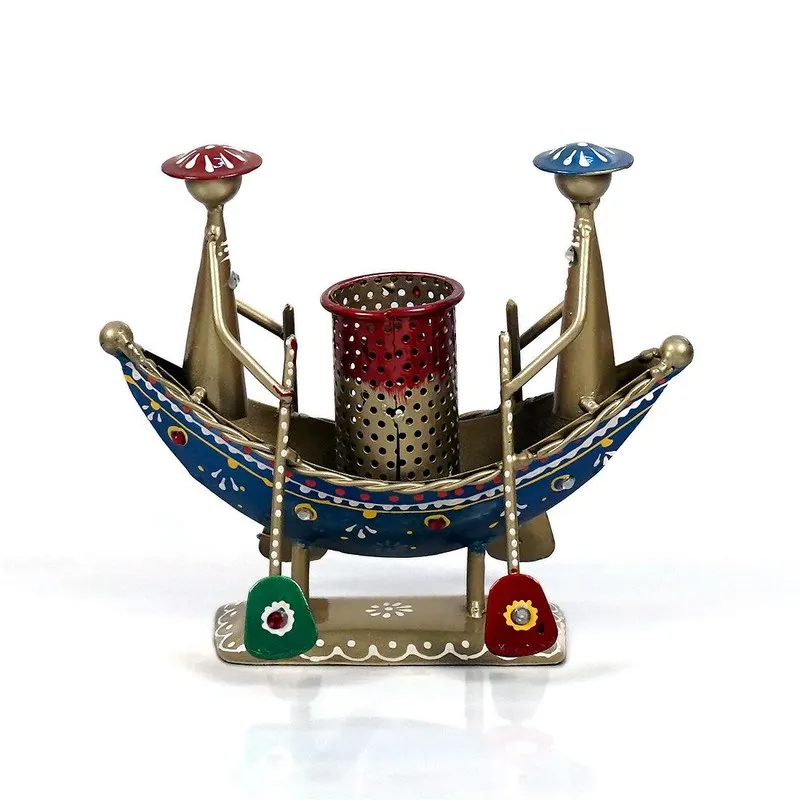 Multicolour metal pen stand with boat design, two figures and perforated centre cup