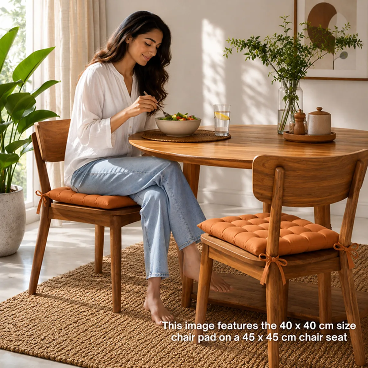 Brown tufted chair pads styled on wooden dining chairs around a table