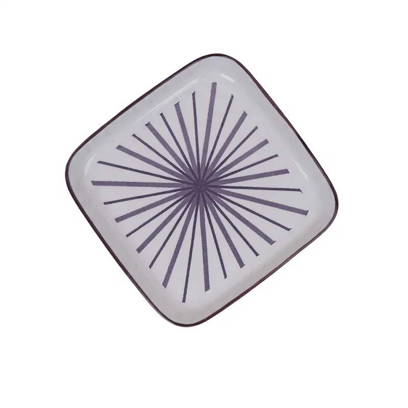 Top view of a single square snack plate with purple burst motif