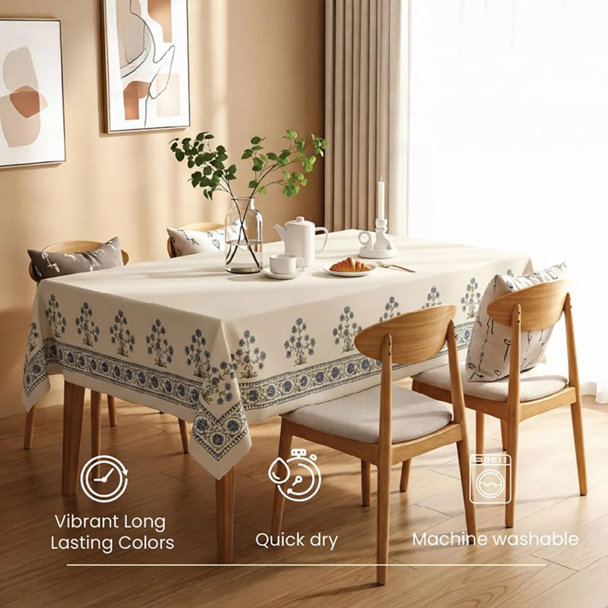 White table cover with blue floral motifs draped over a rectangular dining table