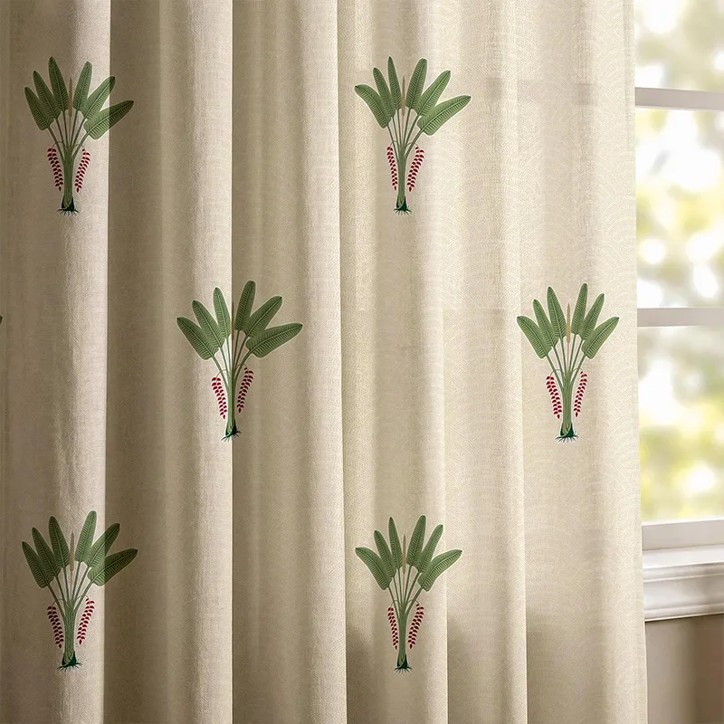 Close-up of off-white curtain with green palm motif print