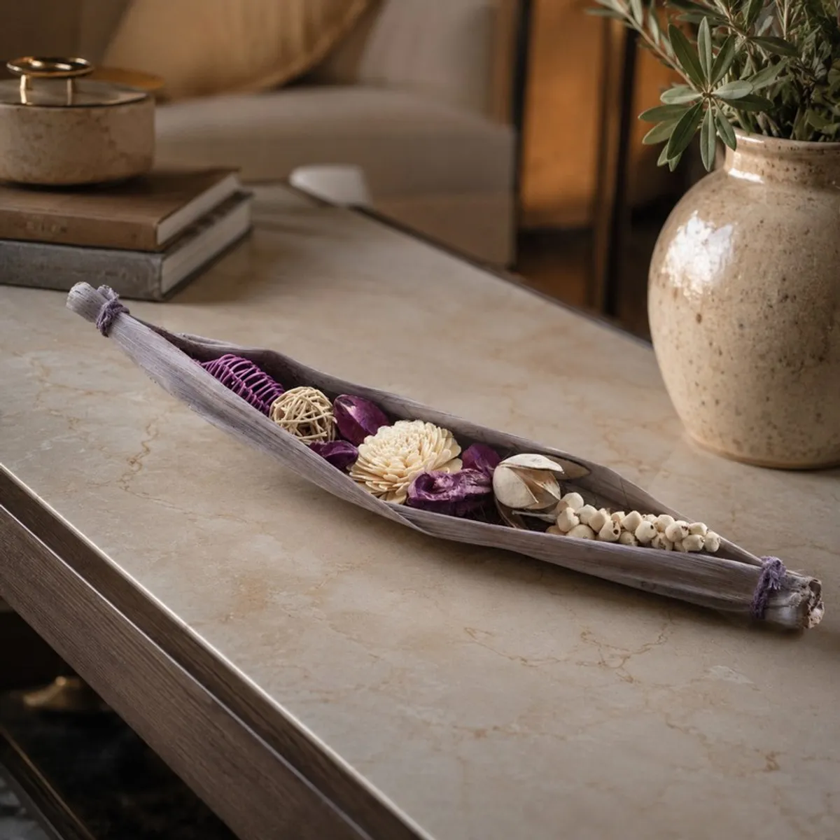 Artificial flower arrangement displayed on a living room coffee table.