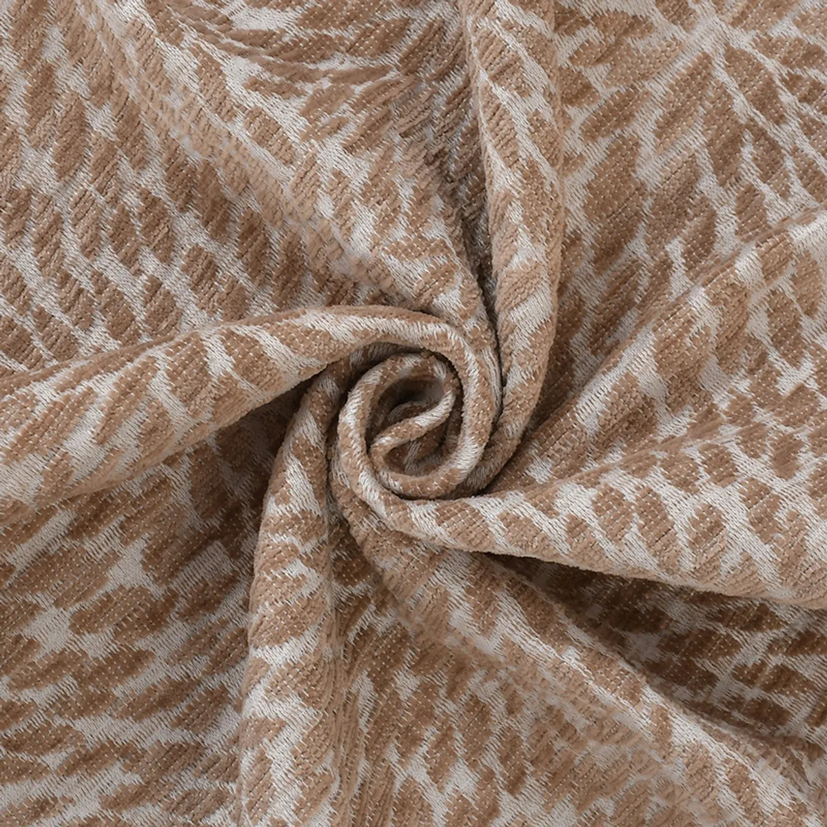 Close-up of beige and cream textured throw fabric