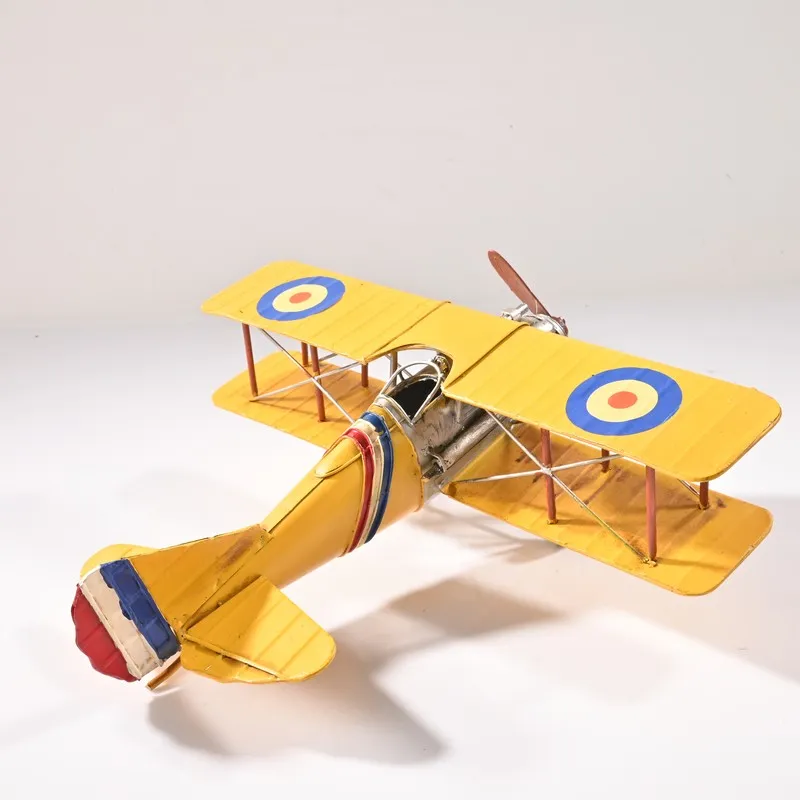 Rear angled view of the yellow vintage biplane showpiece