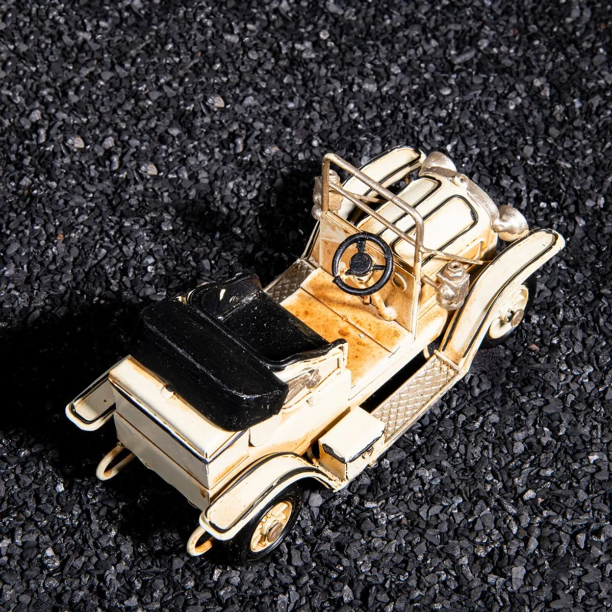 Top rear view of the vintage car showpiece showing seat and steering details