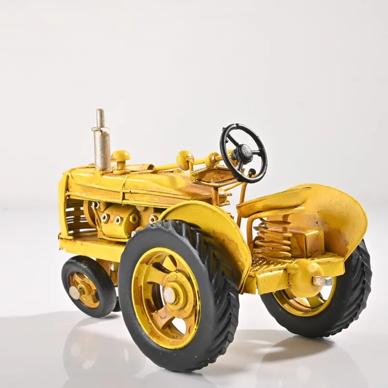 Rear angled view of yellow tractor iron showpiece