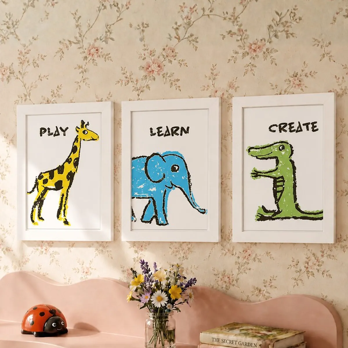 Three framed animal art prints with playful text on a floral wall