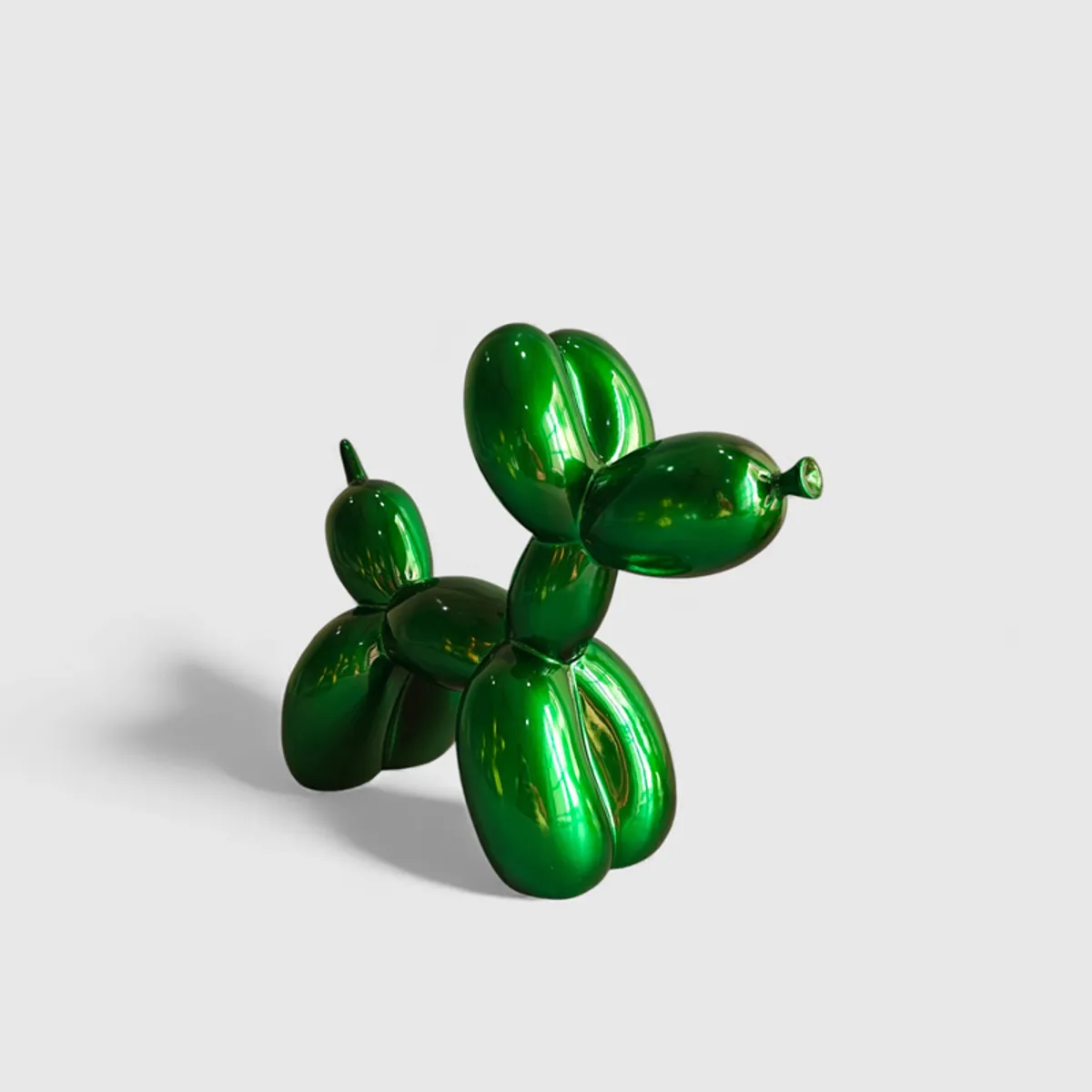 Angled view of the glossy green balloon-dog showpiece.