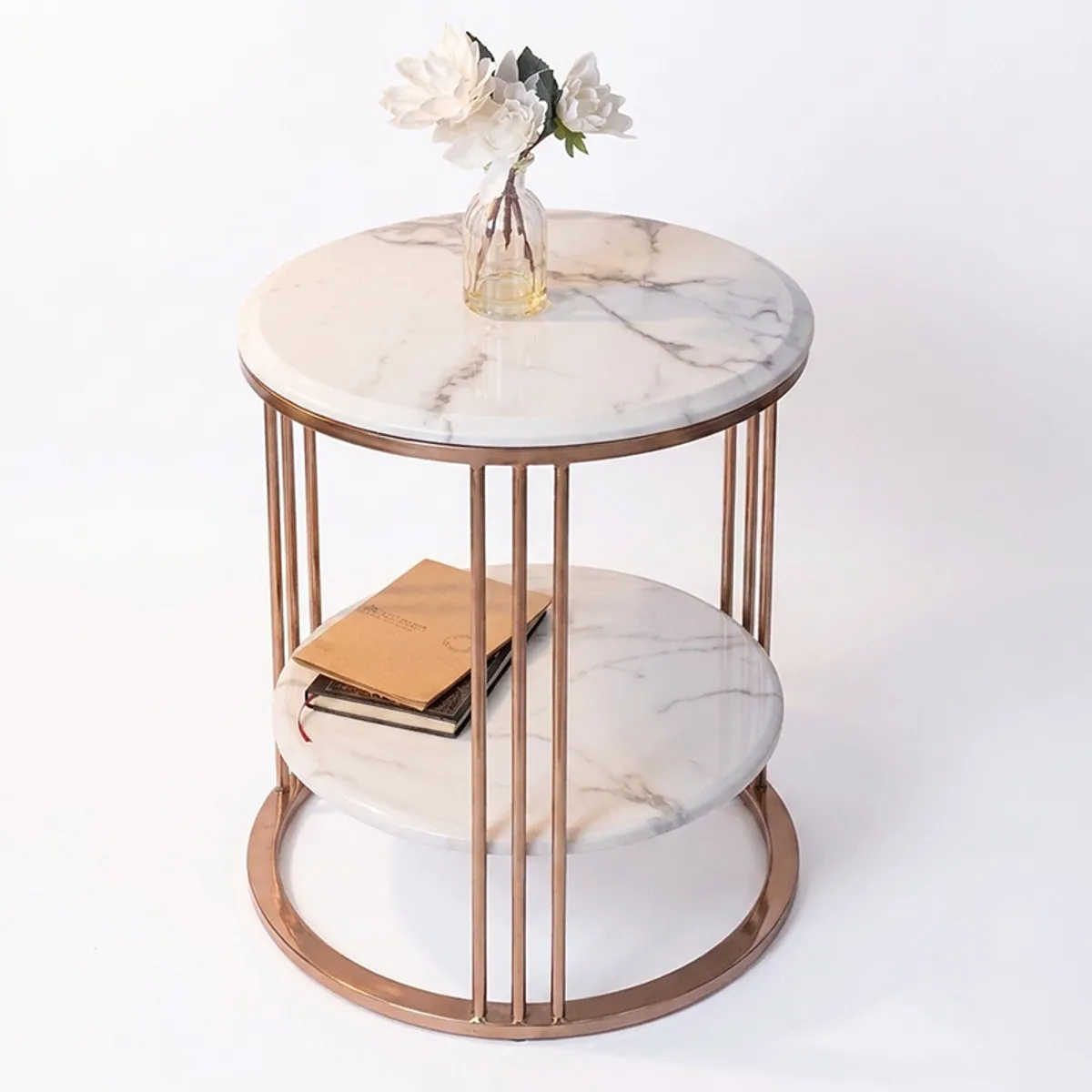 White and gold marble side table displayed against a plain white background
