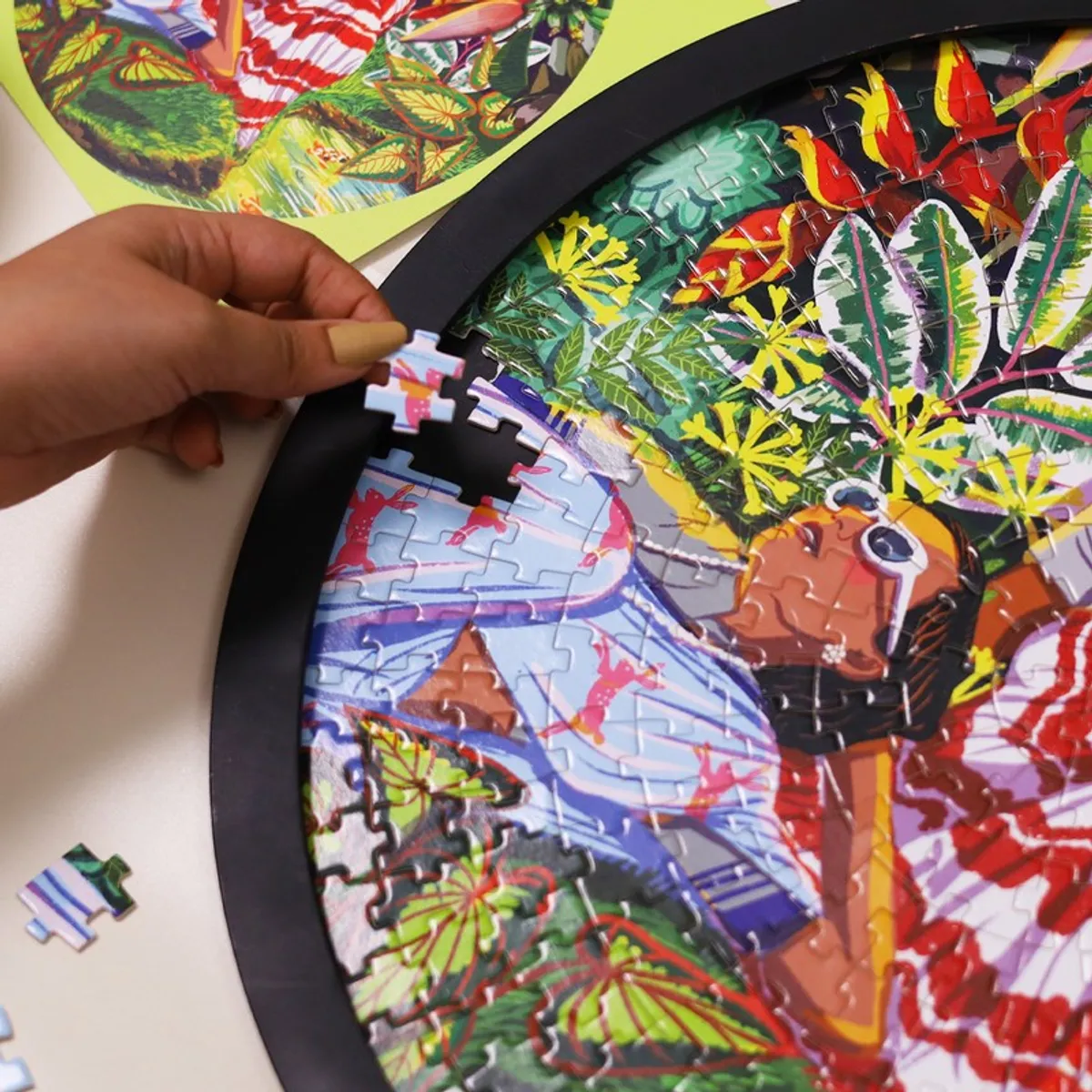 Close-up of the framed puzzle wall art showing interlocking pieces and garden motif
