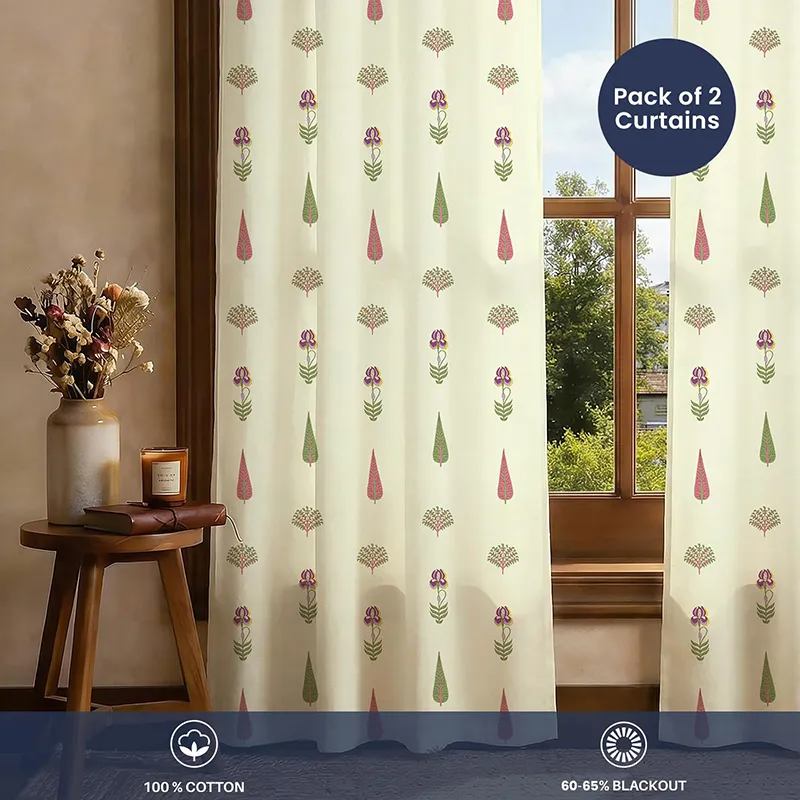 Two printed off-white curtains displayed across a window