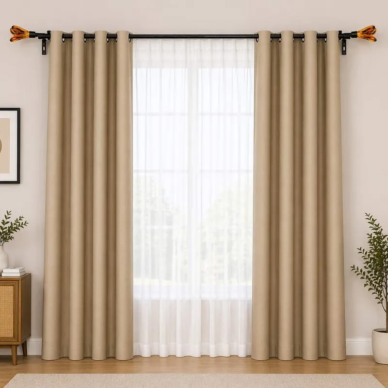 Black double curtain rod styled across a wide window with beige curtains