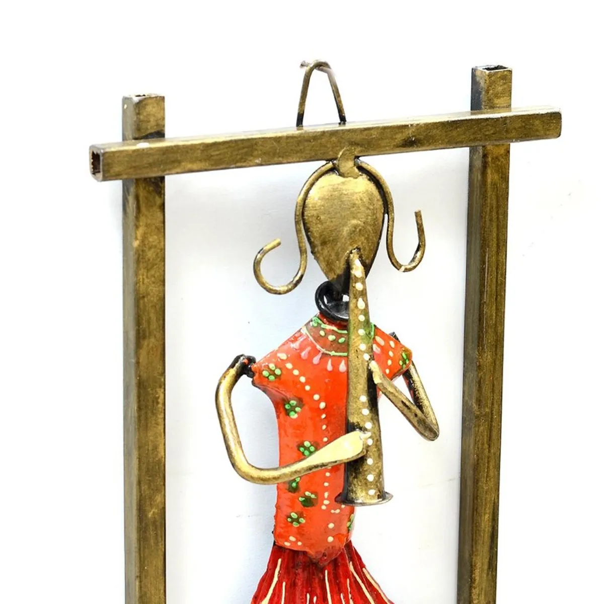 Close-up of a red hand-painted musician metal wall accent