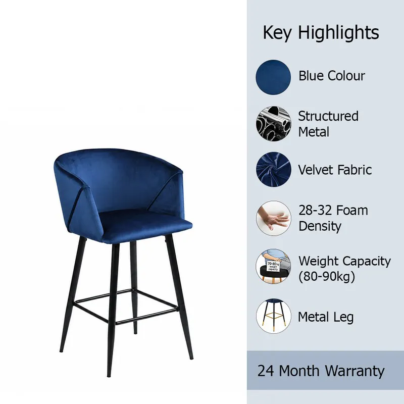 Blue velvet bar chair with black metal legs on a white background