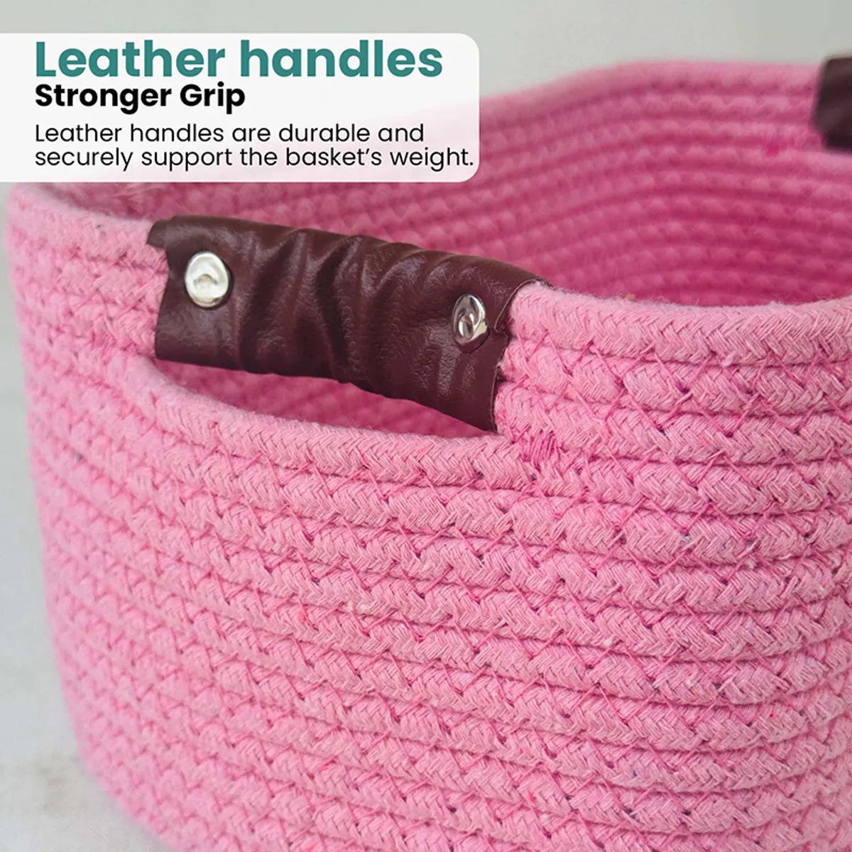 Close-up of the pink woven basket with a brown side handle