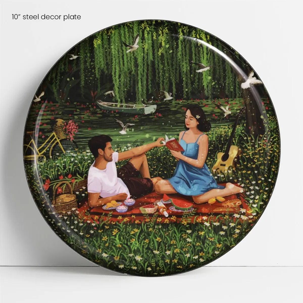 Close-up of a round wall plate with a picnic by the water scene