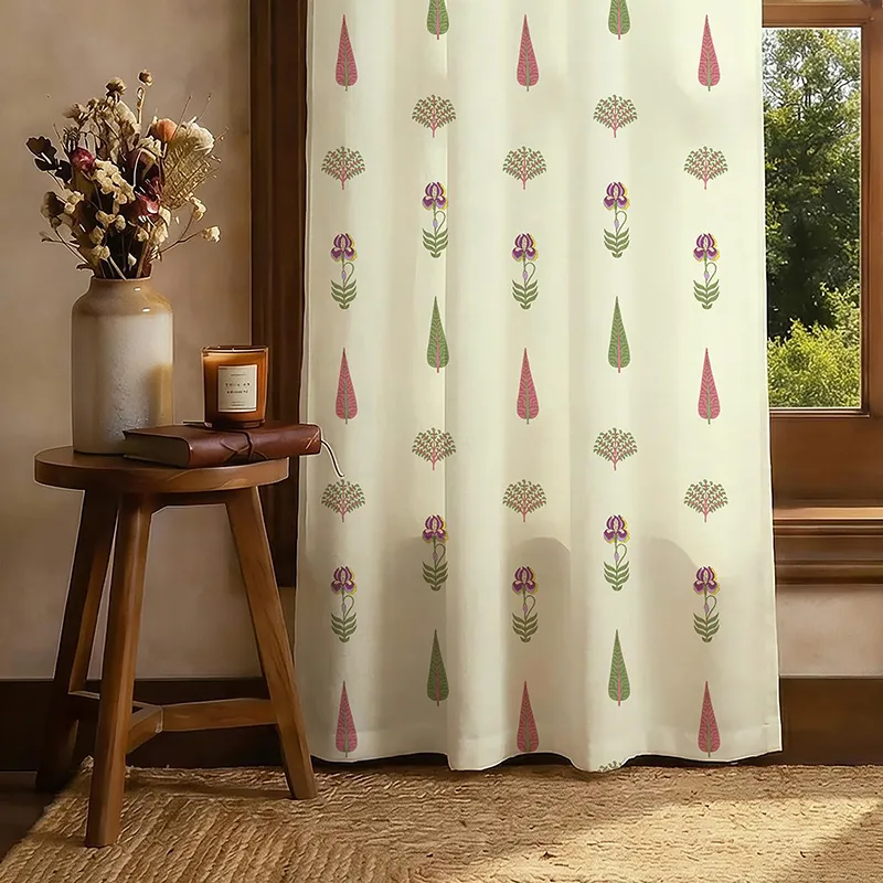 Single off-white printed curtain panel beside a wooden window and side table