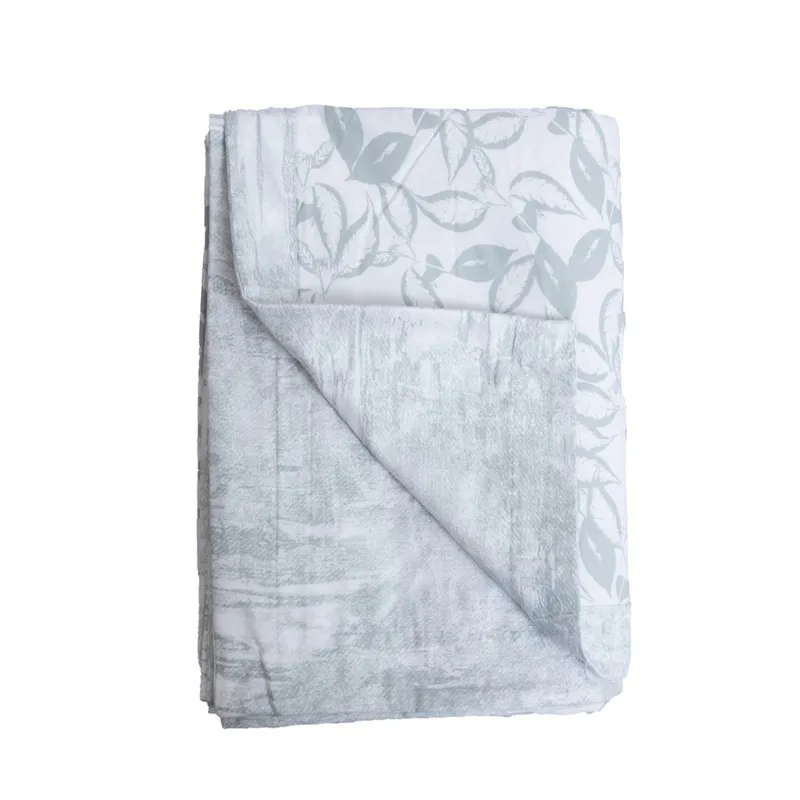 Folded white and pale green reversible printed dohar on a plain background.