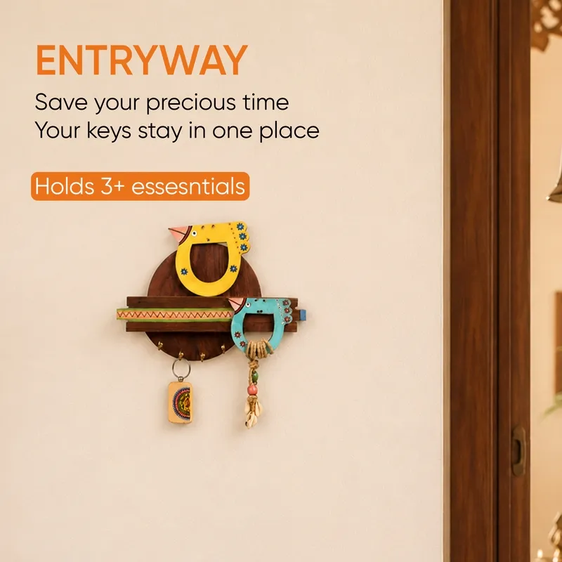 Colourful bird key holder displayed on an entryway wall