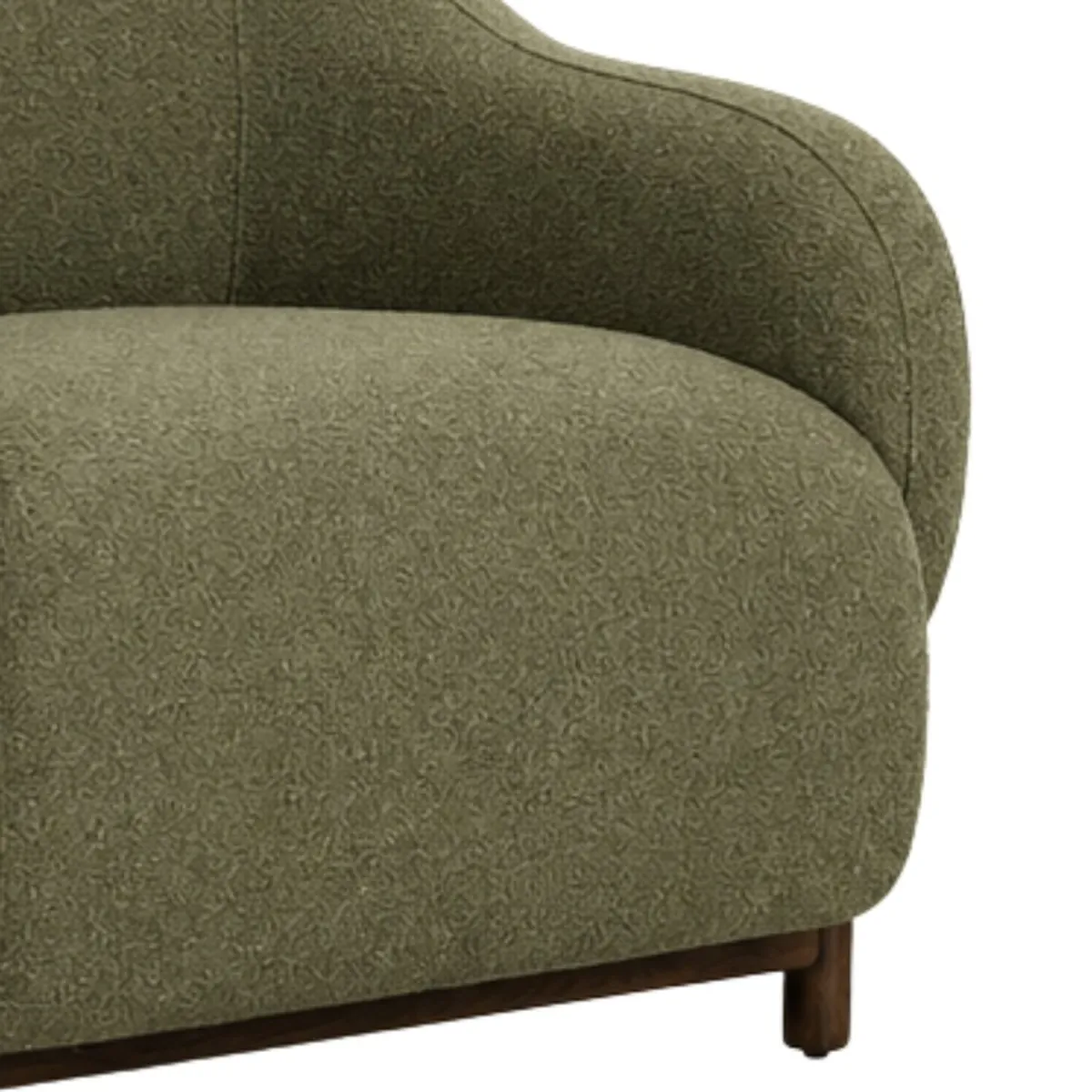 Close-up of sage green upholstered chair arm and dark wood frame