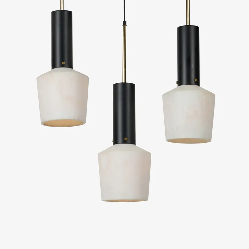 Three clustered pendant lights with off-white shades on a plain background