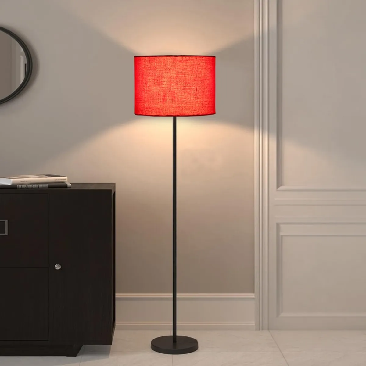 Red floor lamp casting light on a wall beside a dark cabinet